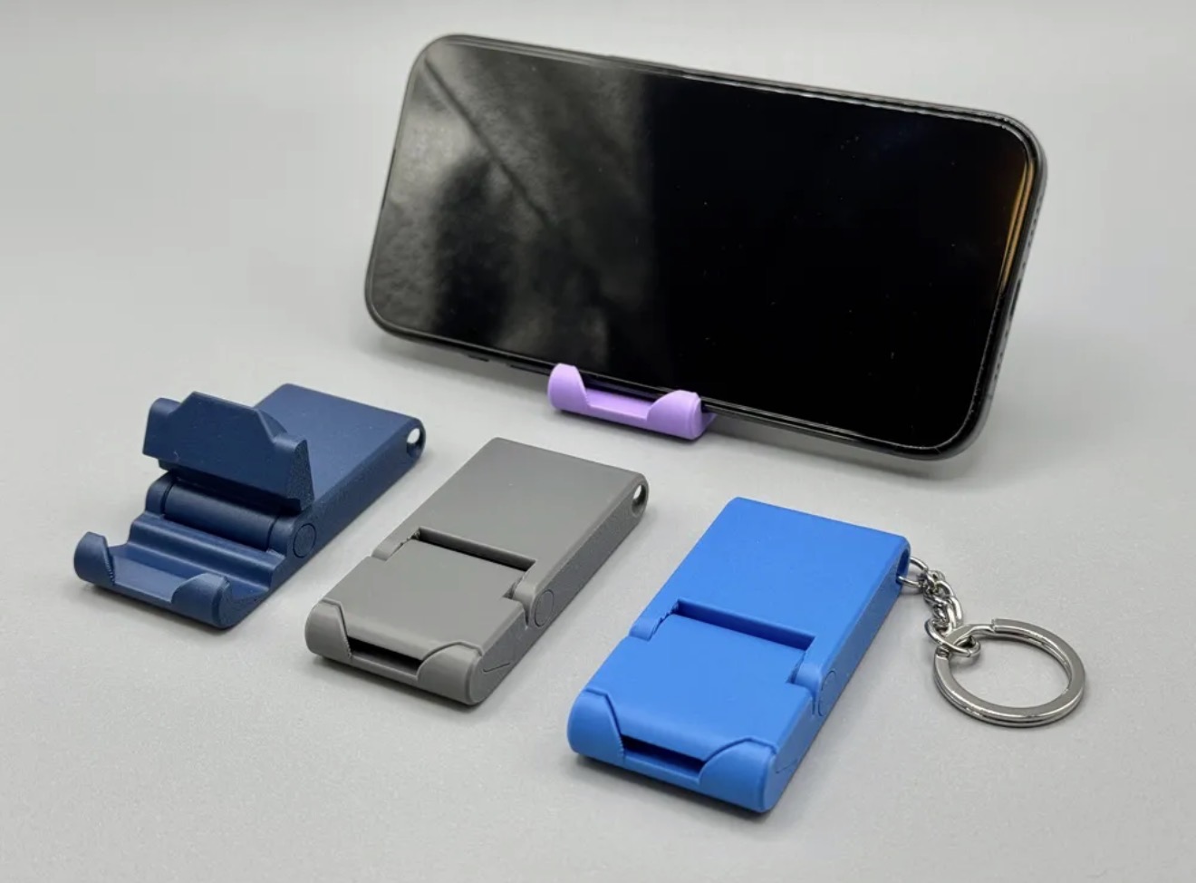 Suporte de celular dobrável que vira chaveiro